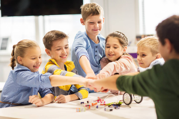 happy children making fist bump at robotics school - Fotografie, Obrázek