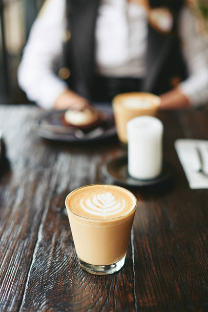 Drinking coffee in cafe restaurant - Фото, изображение