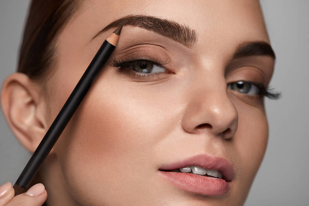 Beautiful Woman Contouring Eyebrows With Pencil. Beauty  - Photo, Image
