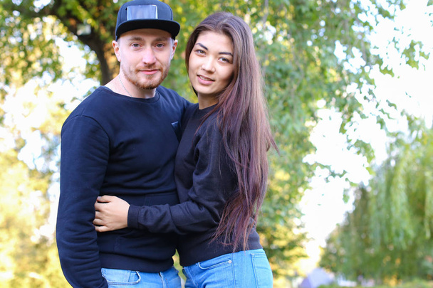 Cute couple talking and hugging each other, posing at camera and - Photo, Image