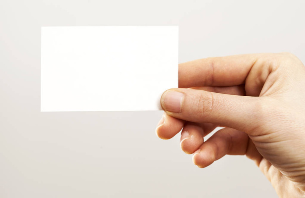 Woman hand holding blank business card - Foto, Bild