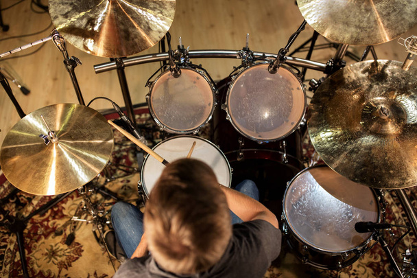 male musician playing drums and cymbals at concert - Photo, Image