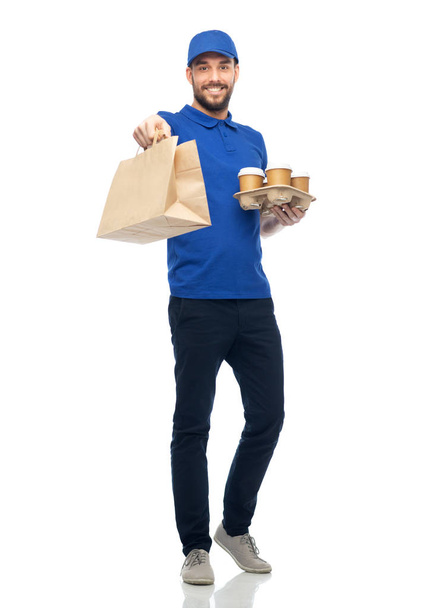 happy delivery man with coffee and food in bag - Φωτογραφία, εικόνα