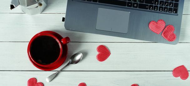 workplace for computer, coffee in a red cup and hearts.flat lay - Foto, Imagen
