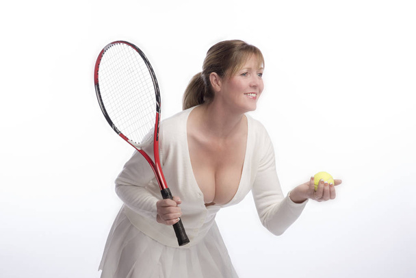 Woman tennis player in a revealing shirt - Photo, Image