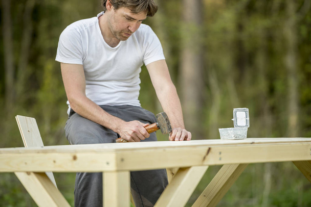 Carpenter working with wood - Фото, зображення