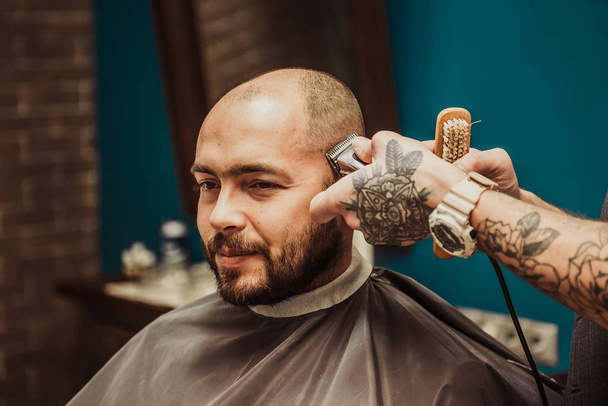 Hairdresser makes hair short man - Photo, Image
