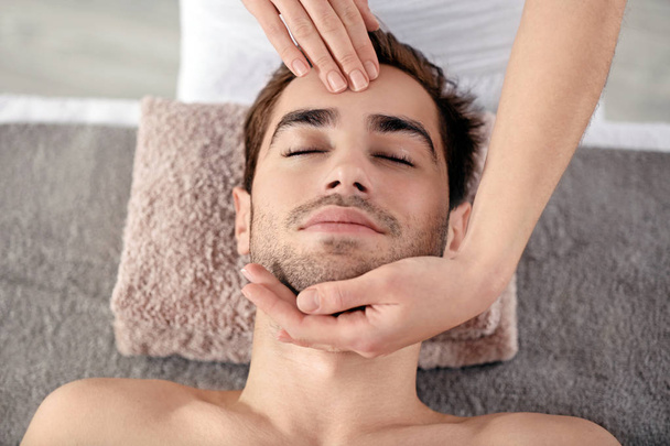 Man relaxing in spa salon - Photo, image