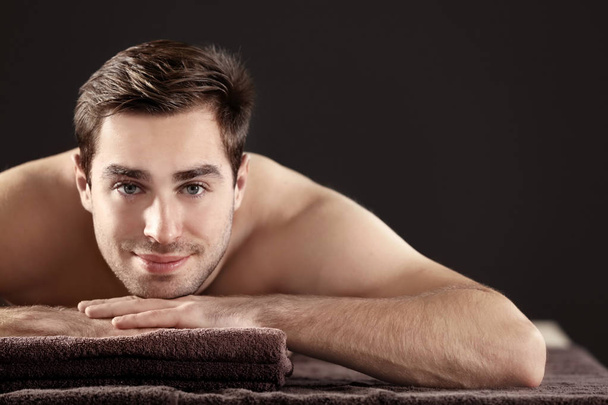 Man relaxing in spa salon - Photo, Image