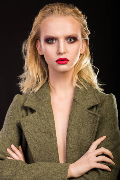 stylish blonde in coat. fashion photo - Photo, image