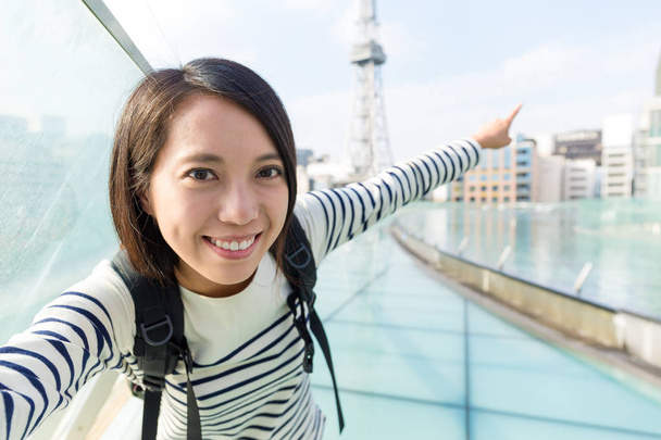 Woman taking selfie in Nagoya city - Photo, Image