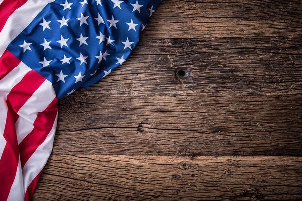 USA flag. American flag. American flag freely lying on wooden board. Close-up Studio shot. Toned Photo - Foto, Bild