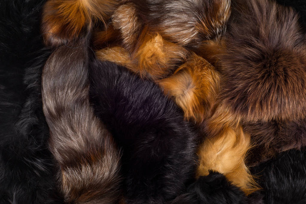 Het patroon, achtergrond. Bont Fox. een vleesetende zoogdier van de hond familie met een spitse snuit en borstelige staart, spreekwoordelijke voor zijn geslepenheid. - Foto, afbeelding