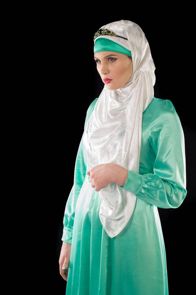 hijab. The Islamic headscarf for women and the general clothing, hides figure, wrists and neck women. Very beautiful girl - Фото, изображение