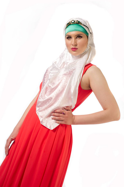 Muslim beautiful girl in the red dress and the hijab - Fotoğraf, Görsel