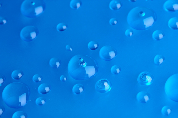 Water drops on blue background - Fotoğraf, Görsel