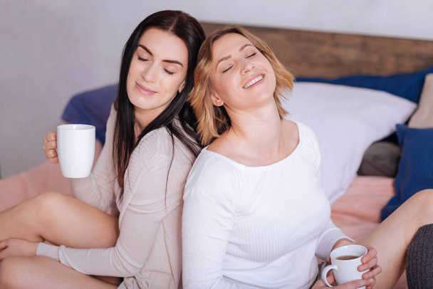 Dreamy gorgeous ladies sharing morning vibes - Photo, image