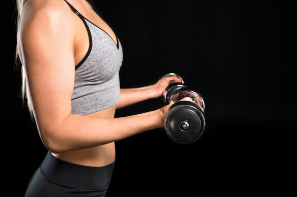 Woman exercising with dumbbells - Foto, Bild