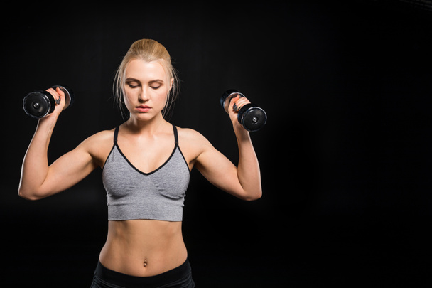 Woman exercising with dumbbells - Photo, Image