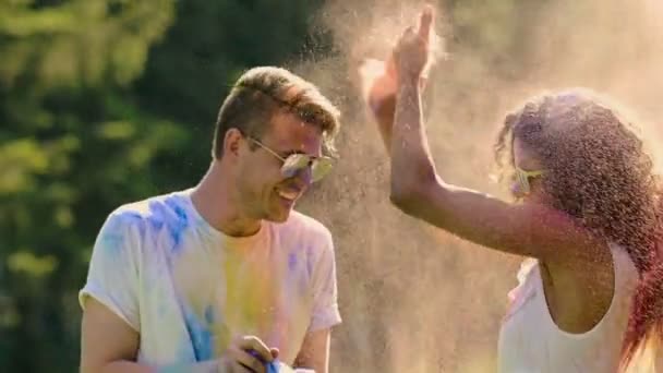 Colored paint battle at Holi festival, friendly atmosphere, super-slow motion - Footage, Video