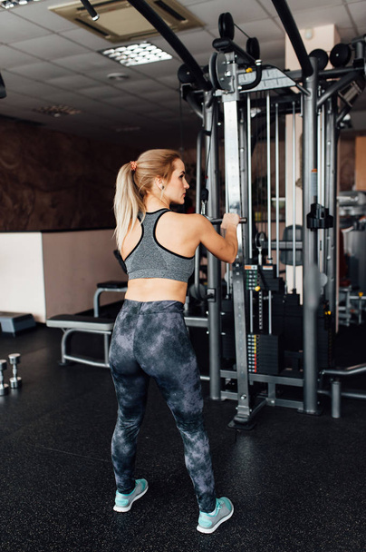 Young athletic woman in the gym - Фото, зображення