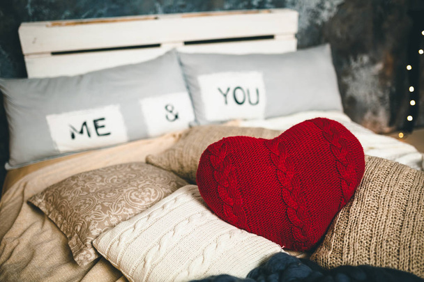 Romantic interior loft-style for Valentine's day with bed, pillows and heart - Valokuva, kuva