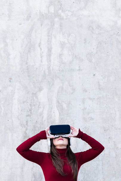 Handsome young woman using VR glasses with space for text - Fotoğraf, Görsel