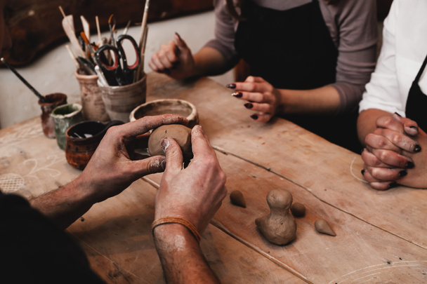 hands working with clay - Фото, зображення