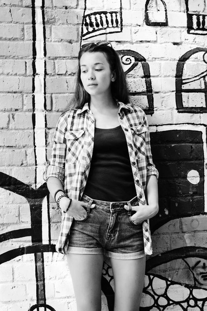 Portrait of beautiful teenage girl weared on checkered shirt and - Foto, Imagem