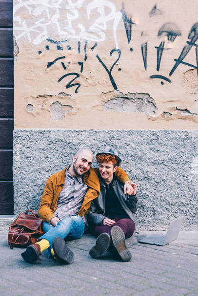 man and woman on floor outdoor  - Fotoğraf, Görsel