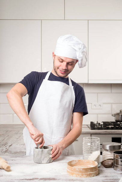 cook chef with a mortar - Фото, изображение