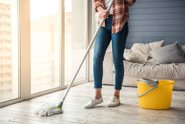 Beautiful woman cleaning house - Fotó, kép
