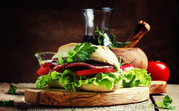 Sandwich with ham, lettuce and tomato  - Fotoğraf, Görsel