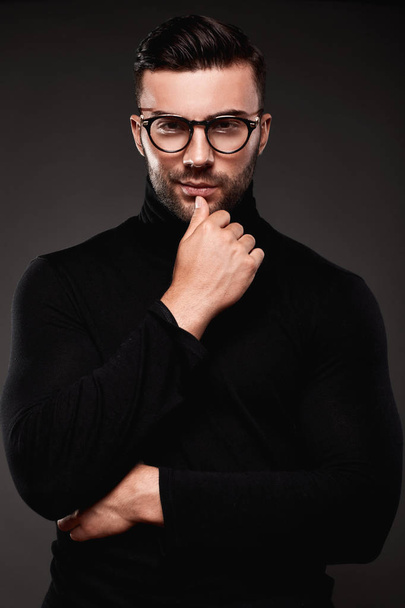 Serious thoughtful handsome man in golf and glasses - Zdjęcie, obraz