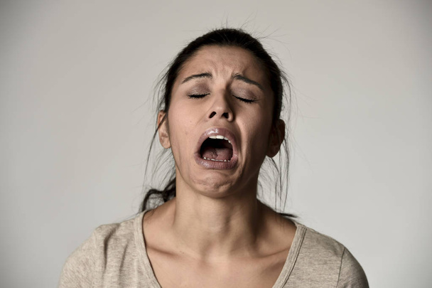 spanish sad woman serious and concerned crying desperate overacting on feeling depressed - Photo, Image