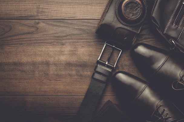 brown shoes, belt, socks and film camera - Фото, изображение
