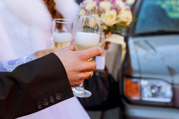 Celebration. Couple holding glasses of champagne making a toast. - Photo, Image