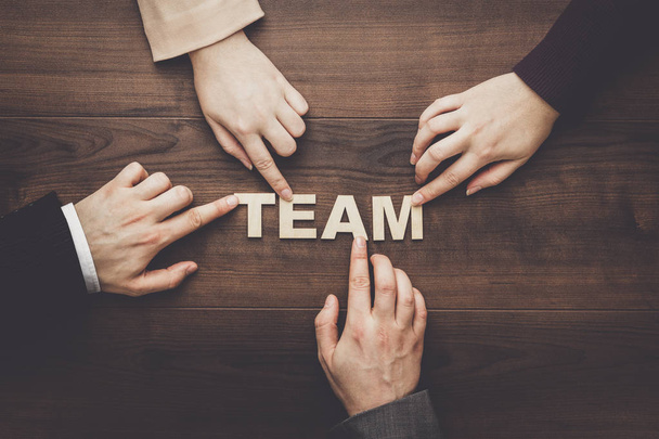 team concept on the brown wooden table background - Fotoğraf, Görsel