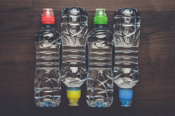 plastic water bottle on the table - Fotoğraf, Görsel