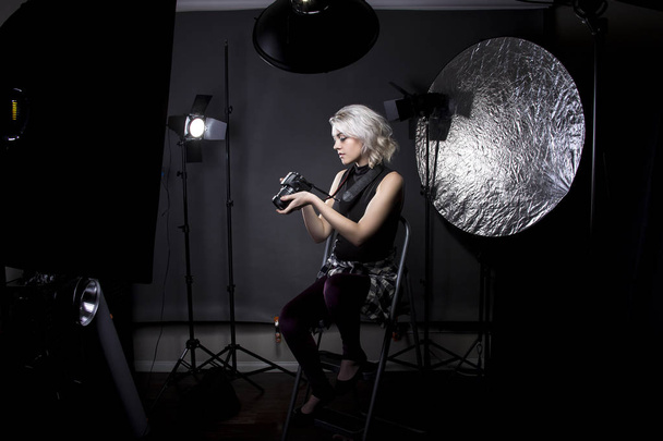 Female Professional Photographer in a Studio - Фото, изображение