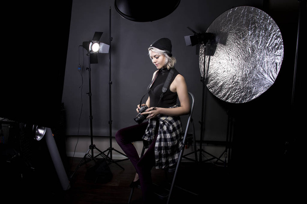Female Professional Photographer in a Studio - Zdjęcie, obraz