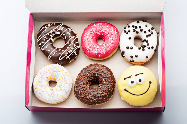 donuts set in box on white - Фото, зображення