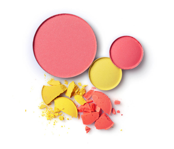 Round pink blusher with yellow and orange crashed eyeshadow for make up as sample of cosmetics product  - Φωτογραφία, εικόνα