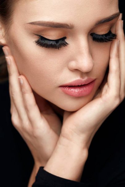 Beautiful Woman With Face Makeup And Long Black Eyelashes - Fotó, kép