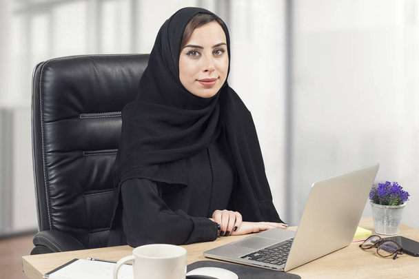 Young Arabian Businesswoman working in the office - Фото, зображення