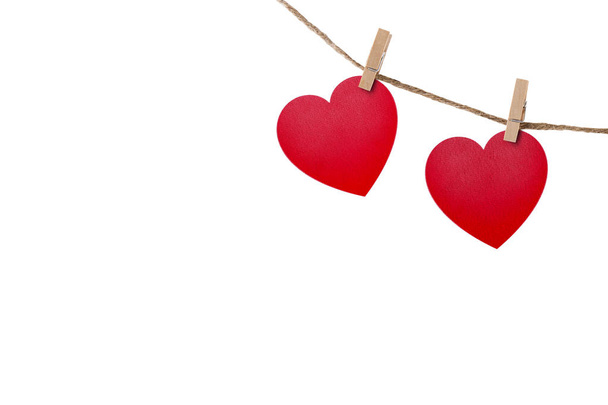 Love hearts hanging on rope on white with clipping path - Фото, изображение