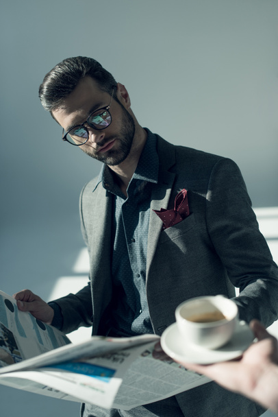 Handsome businessman with newspaper - Fotografie, Obrázek