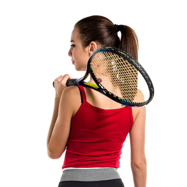 Досить спортивна жінка грає в теніс
 - Фото, зображення