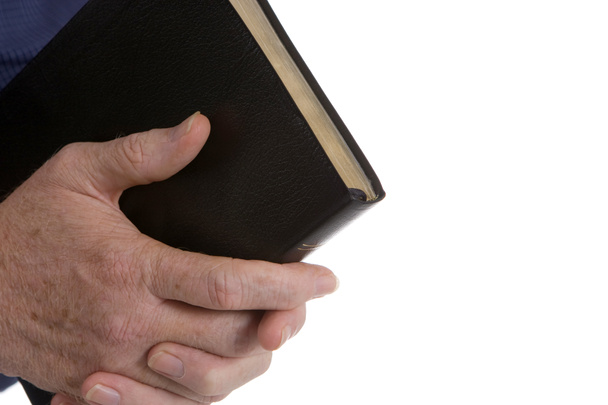 Sosteniendo la Biblia
 - Foto, imagen