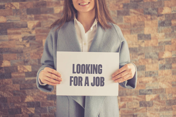 Woman presenting LOOKING FOR A JOB CONCEPT - Foto, Imagem